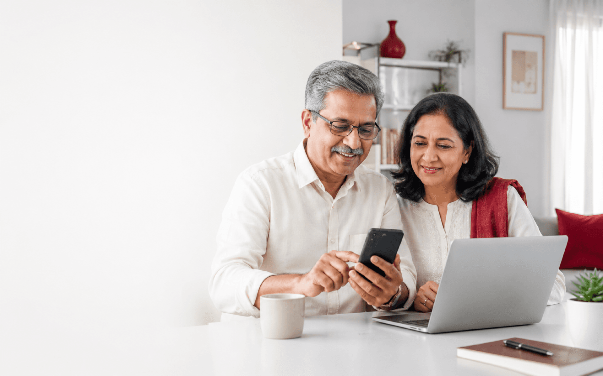 Indian family using phone for tax, claim and business paperwork support